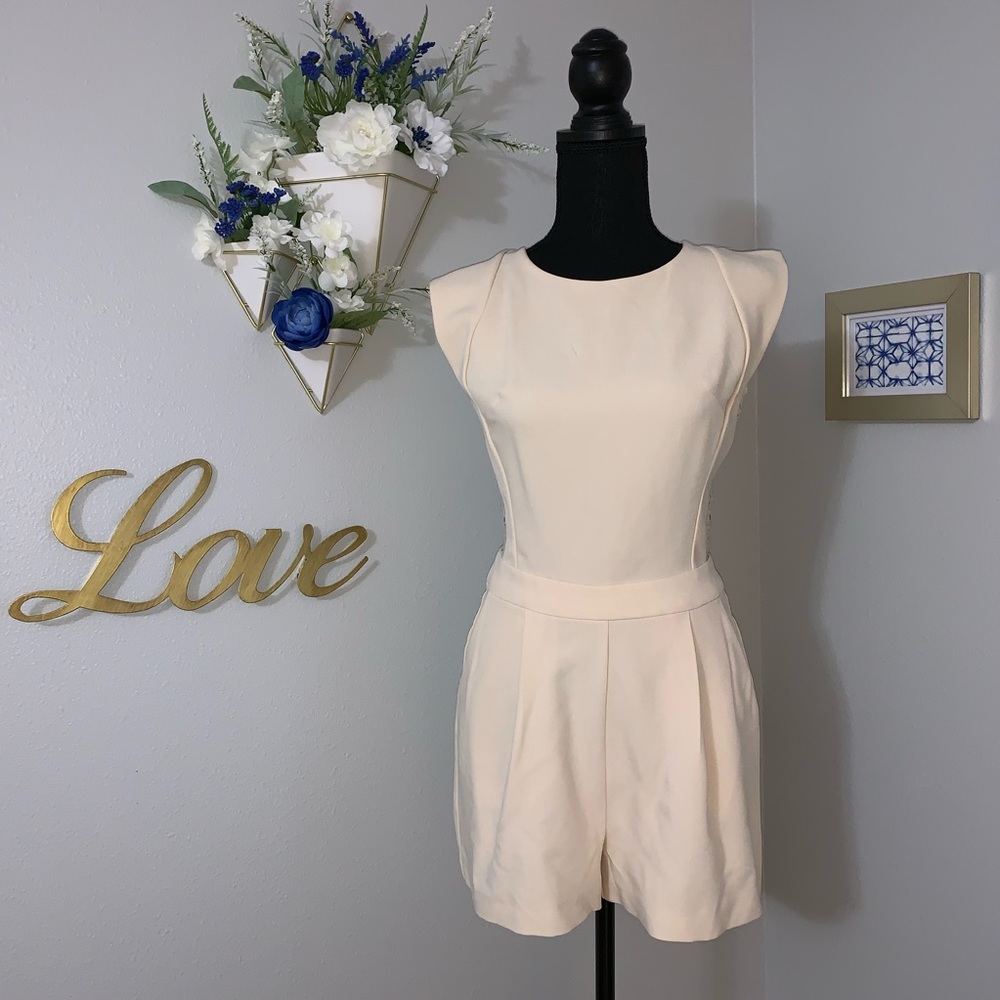Cap sleeves Cream romper. Lace back. NWT. Size M